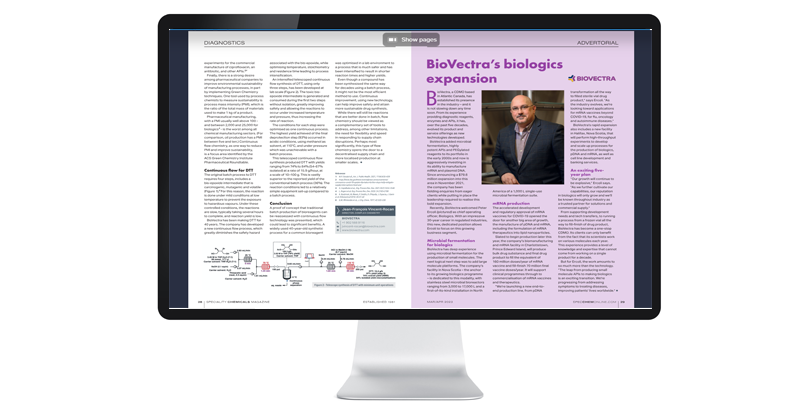 A desktop monitor displays a magazine article about BioVectra's biologics expansion, featuring a person. Technical diagrams and text are included.