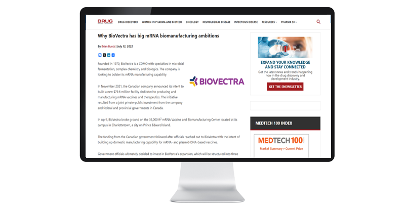 A computer monitor displays an article about BioVectra's mRNA biomanufacturing expansion ambitions, highlighting plans and investments in manufacturing facilities in Canada.