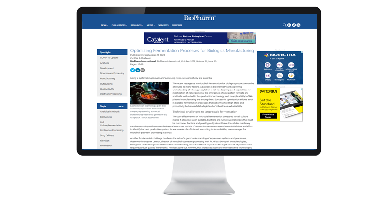 A computer screen displays a BioPharm International article titled "Optimizing Fermentation Processes for Biologics Manufacturing." It features various related ads and navigation menus.